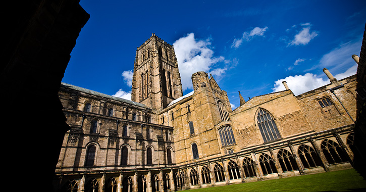 view of Durham Cathedral central tower from the cloisters on a sunny day. 